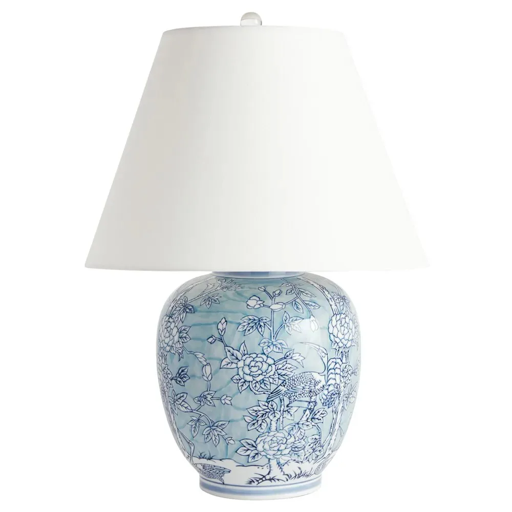 Blue chinoiserie porcelain table lamp with a pale shade