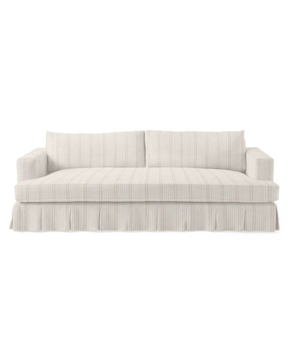 Cream skirted upholstered sofa with a classic wide arm