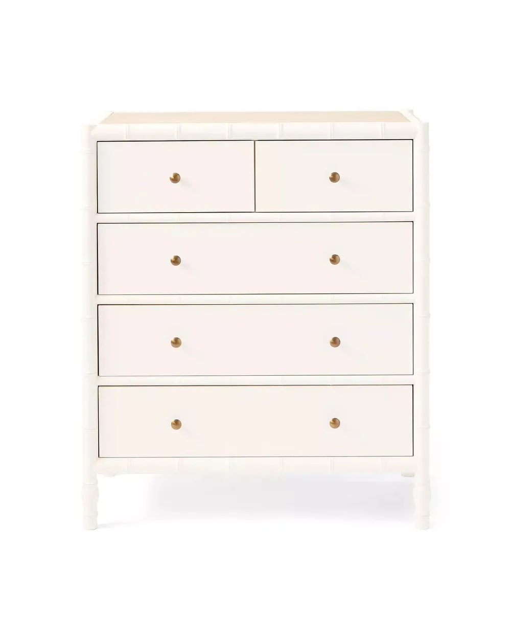 White dresser with clean lines and brass pulls