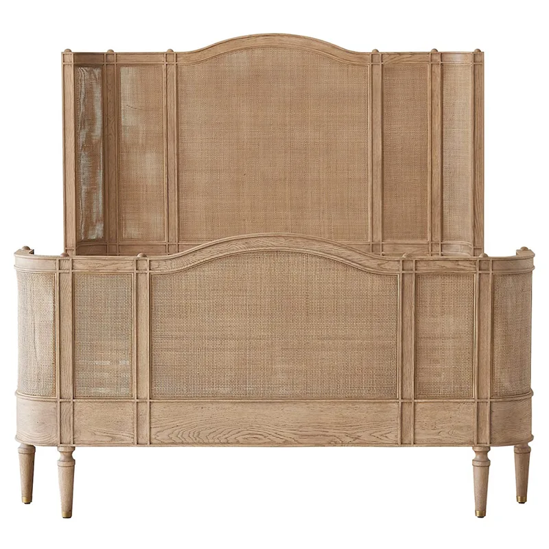 Bed with curved cane headboard and footboard in oak with brass-capped legs